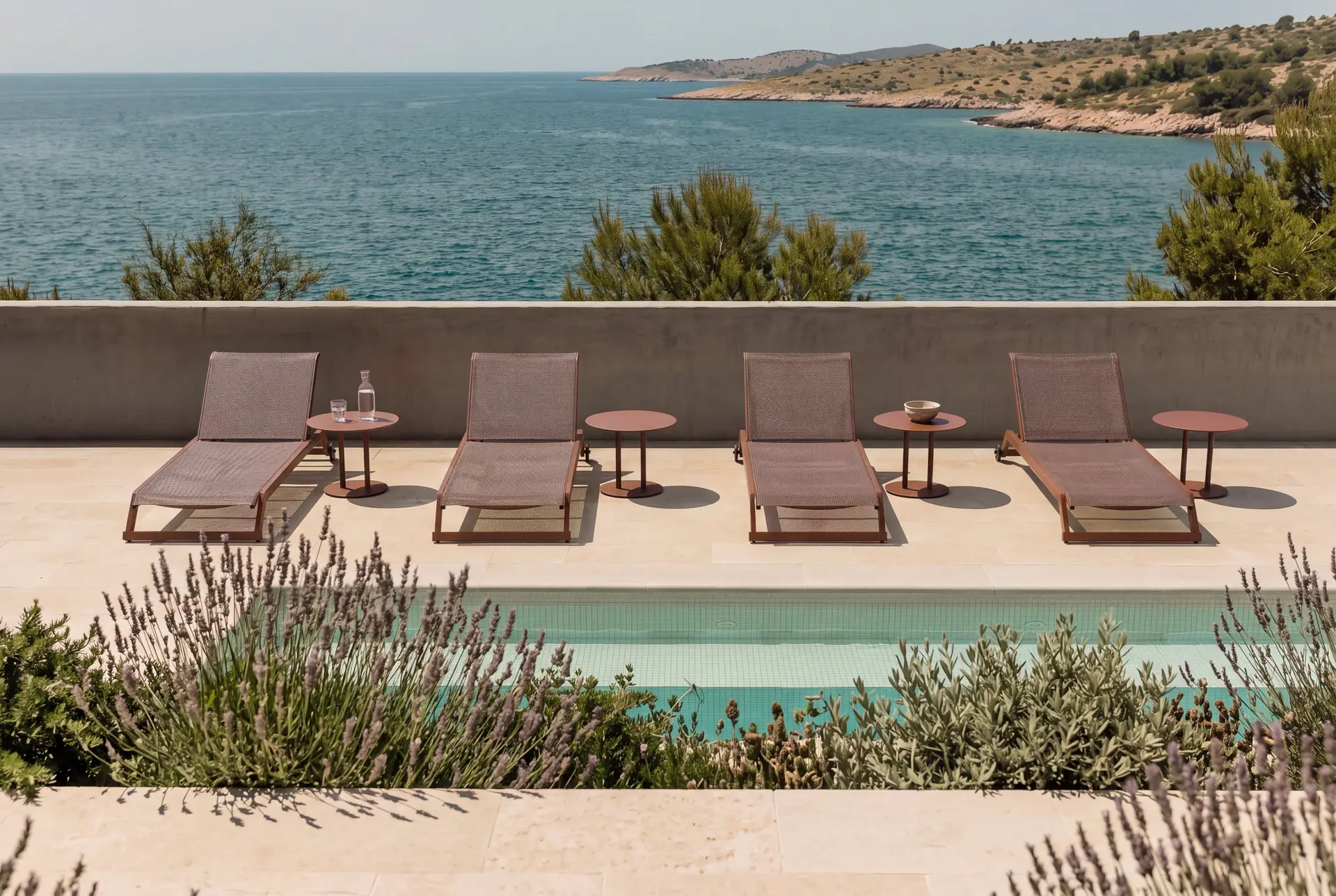 Ilar loungers on a terrace overlooking the sea — Skyline Design